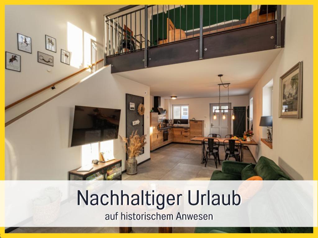 an open living room and kitchen in a house at RamosHansenHof Fewo Hofglück 4Pers mit Hund in Steinberg