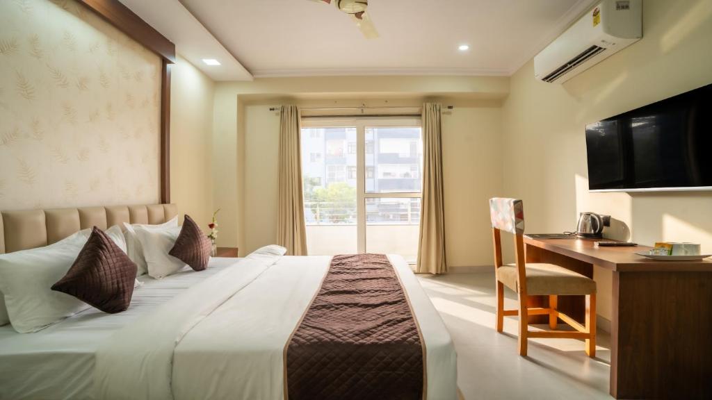 Ένα ή περισσότερα κρεβάτια σε δωμάτιο στο Hotel SGI - Jaipur Airport Hotel