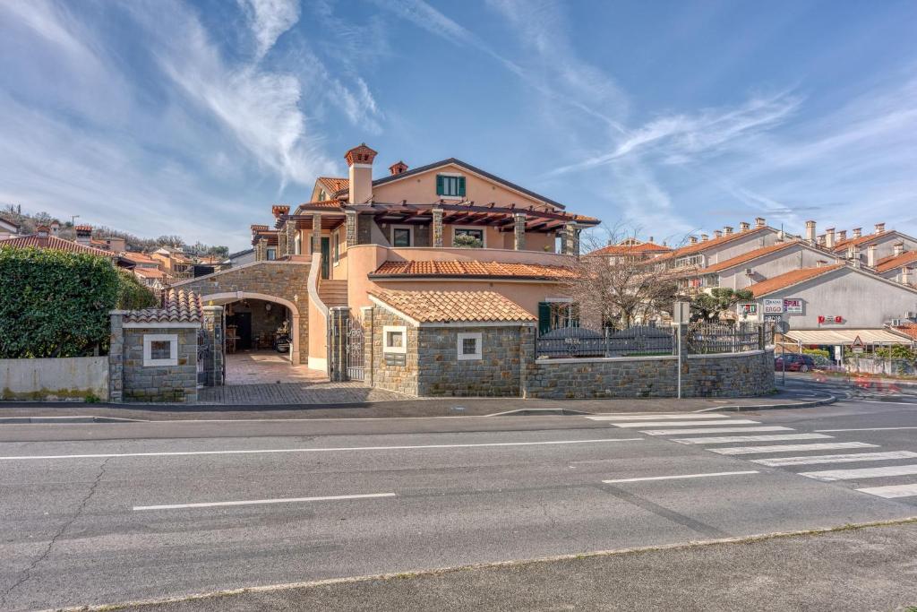 a large house on the side of a street at Villa Marittima in Izola
