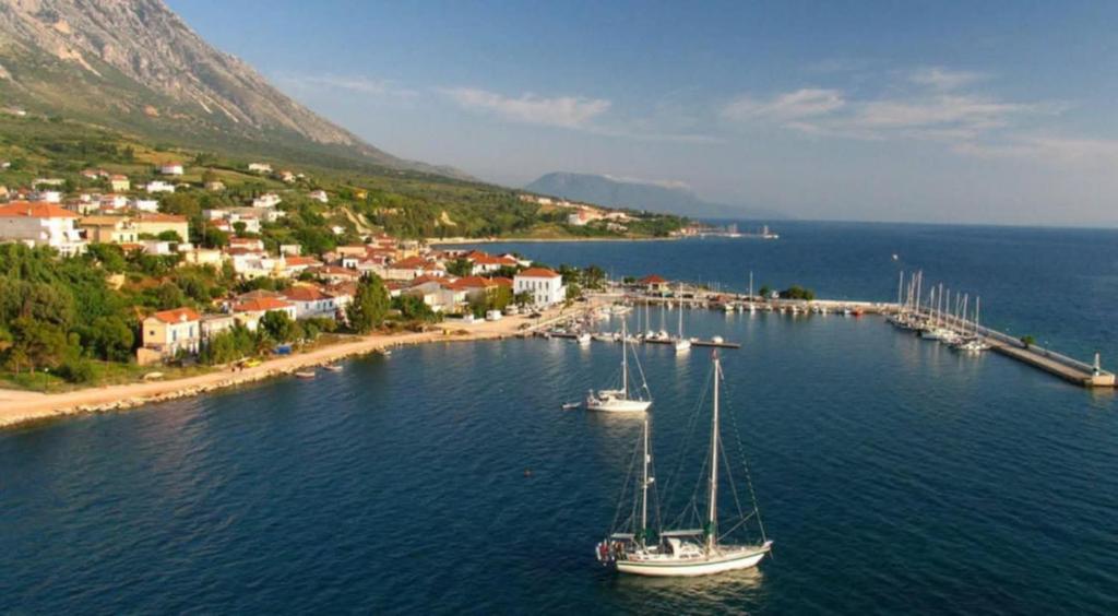 an island with two boats in the water at Paleros vacation in Paleros