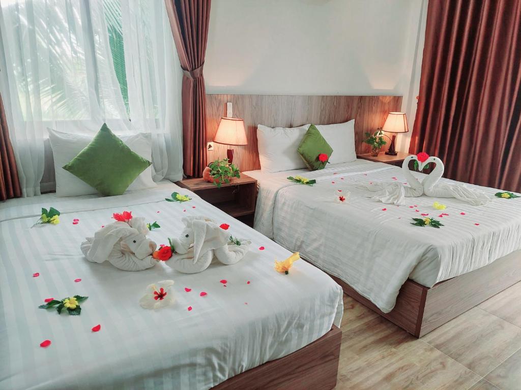 Postel nebo postele na pokoji v ubytování An Villa Beach Paradise