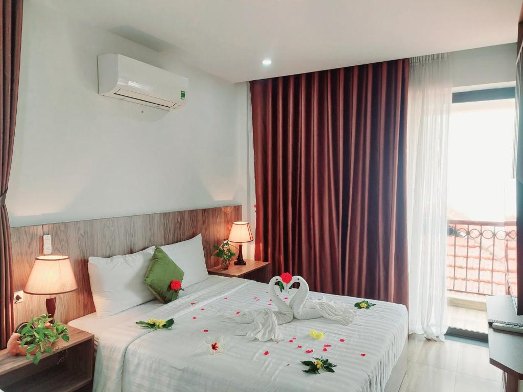 Postel nebo postele na pokoji v ubytování An Villa Beach Paradise