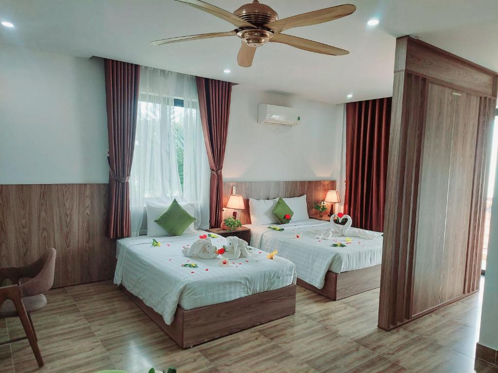 Postel nebo postele na pokoji v ubytování An Villa Beach Paradise