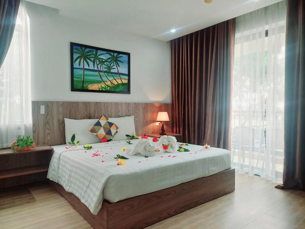 Postel nebo postele na pokoji v ubytování An Villa Beach Paradise