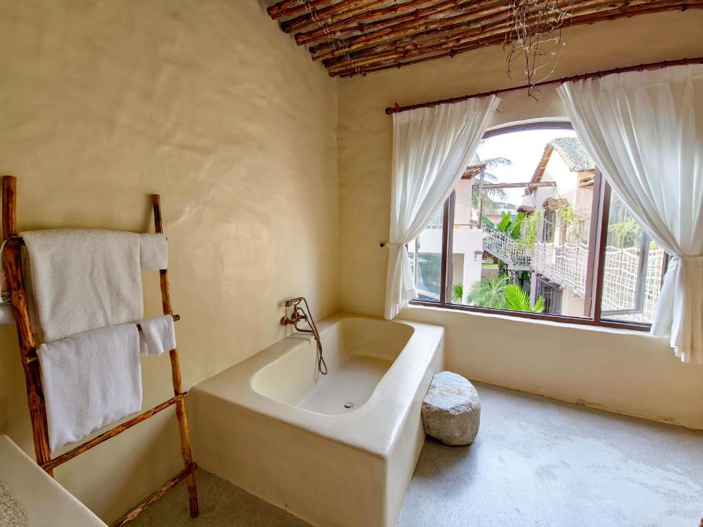 Giường trong phòng chung tại Red Sands Mui Ne