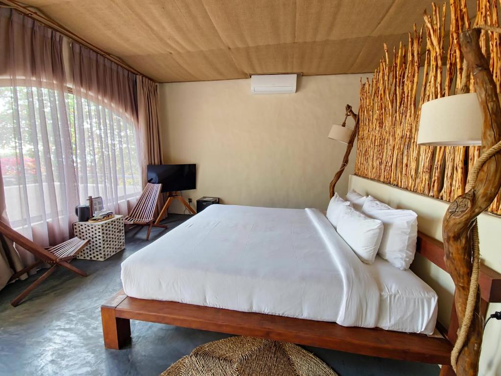 Giường trong phòng chung tại Red Sands Mui Ne