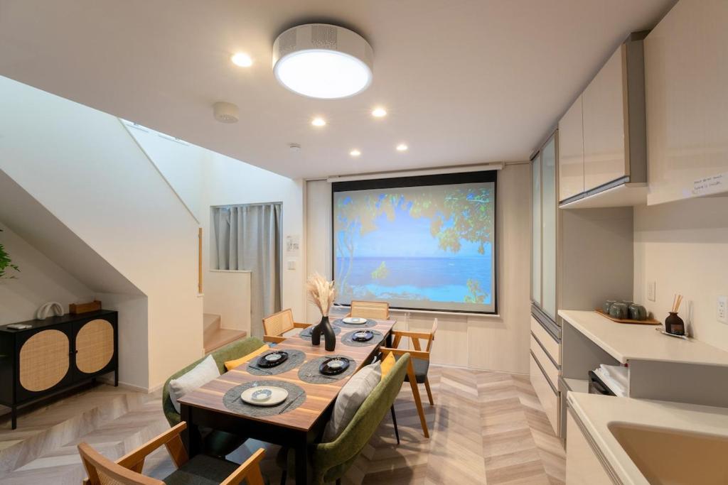 a dining room with a table and a large window at JR EBISU walk for 5min in Tokyo