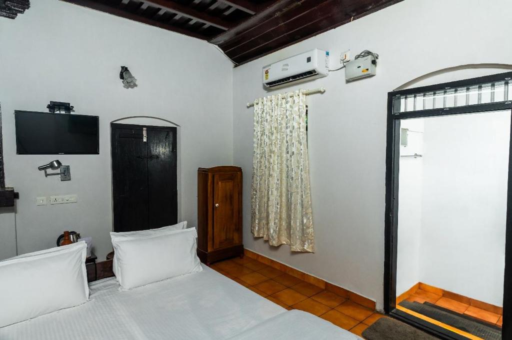 Katil atau katil-katil dalam bilik di Babira brookside heritage resort