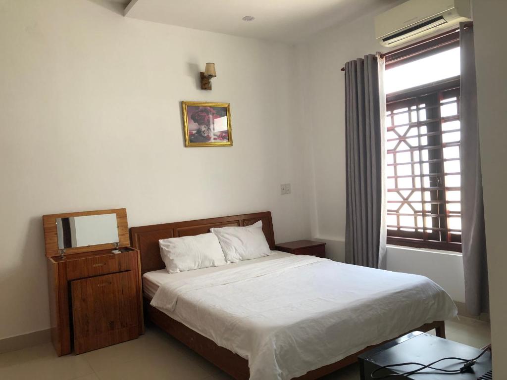 Postel nebo postele na pokoji v ubytování Motel Minh Thảo