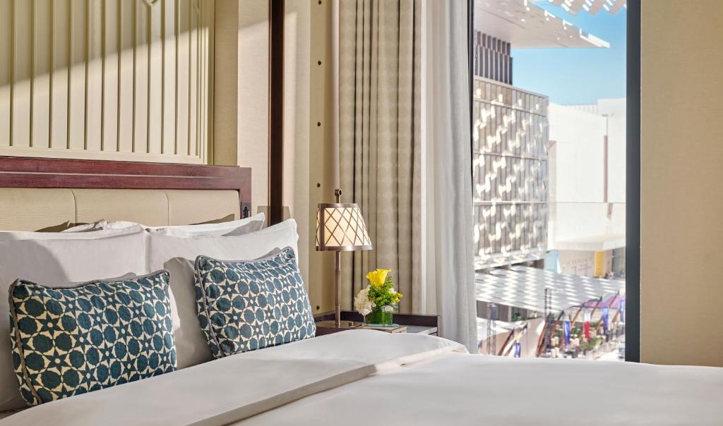 Postel nebo postele na pokoji v ubytování Mandarin Oriental, Doha