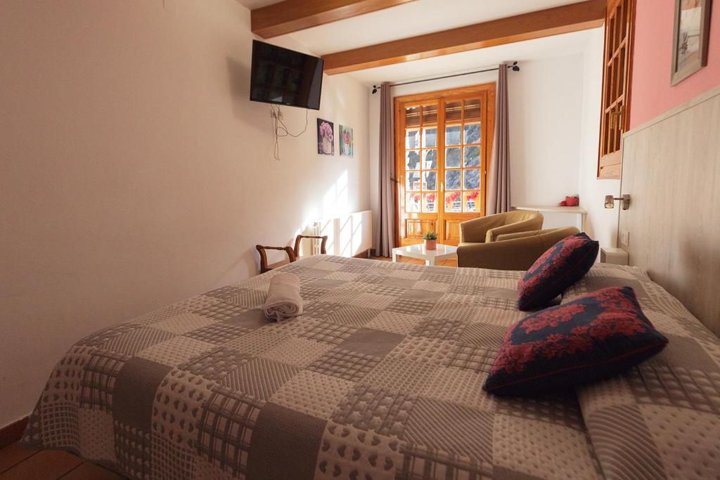 Postel nebo postele na pokoji v ubytování HOTEL LAMOGA