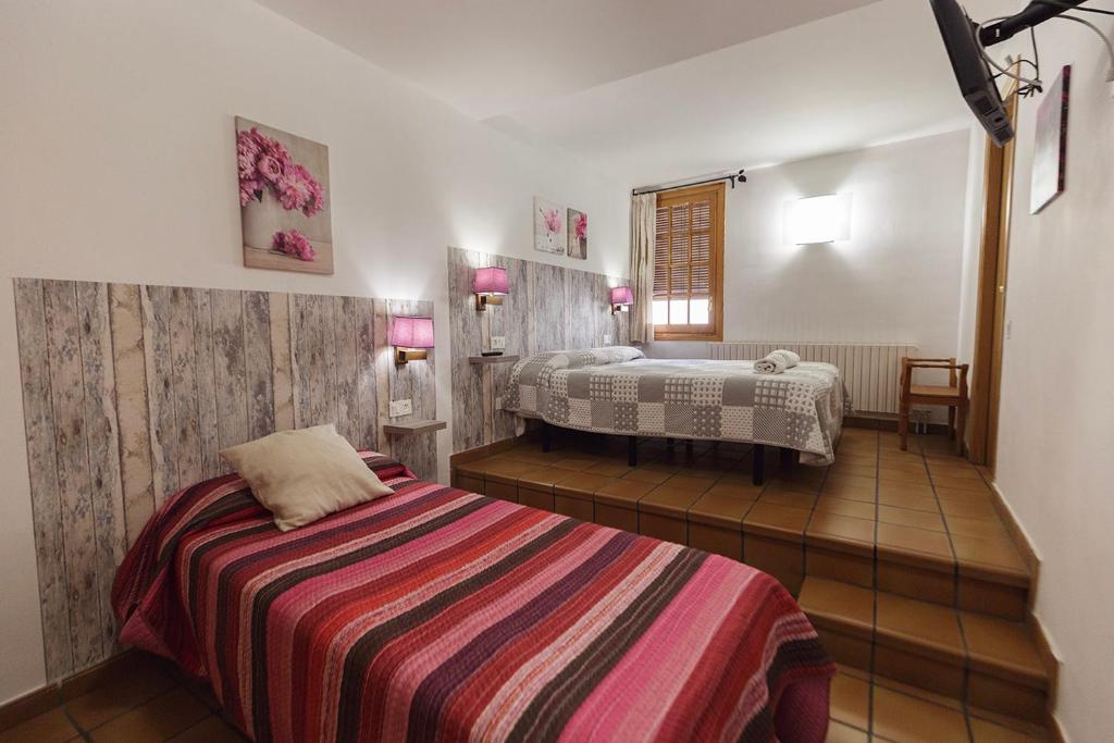 Postel nebo postele na pokoji v ubytování HOTEL LAMOGA
