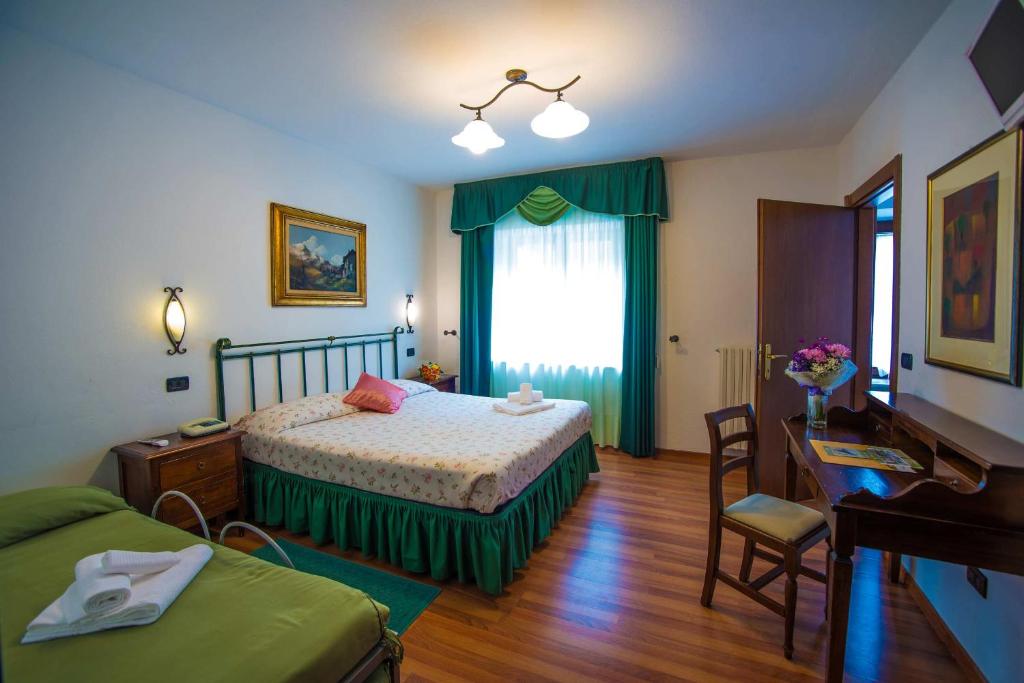 Postel nebo postele na pokoji v ubytování Albergo Le Macinaie - Monte Amiata