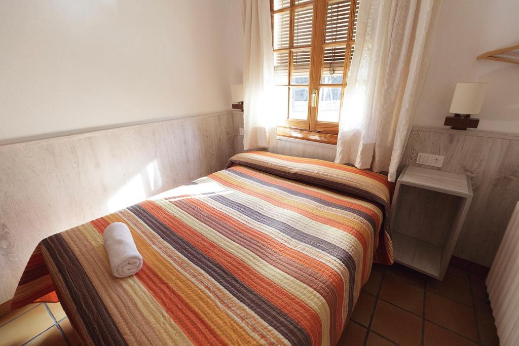 Postel nebo postele na pokoji v ubytování HOTEL LAMOGA