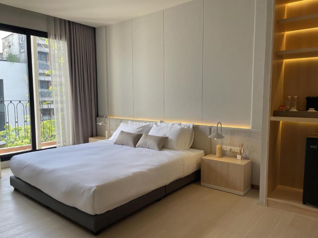 Een bed of bedden in een kamer bij Chinatown Heritage, Chinatown Main road