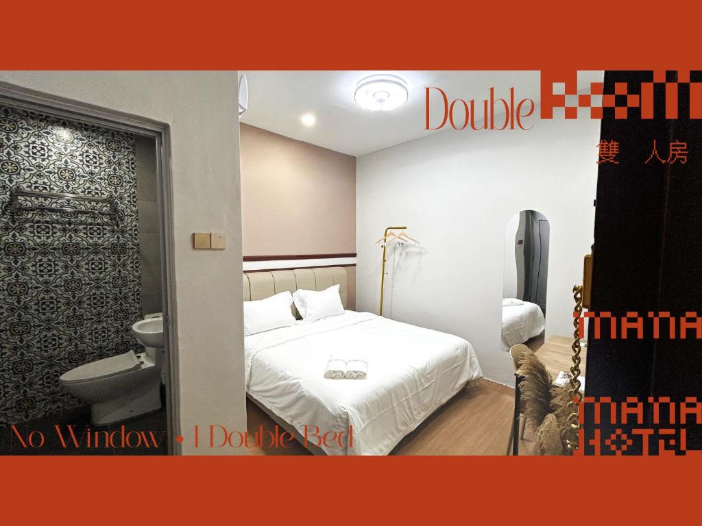 Postel nebo postele na pokoji v ubytování Mana Mana Hotel • Melaka •