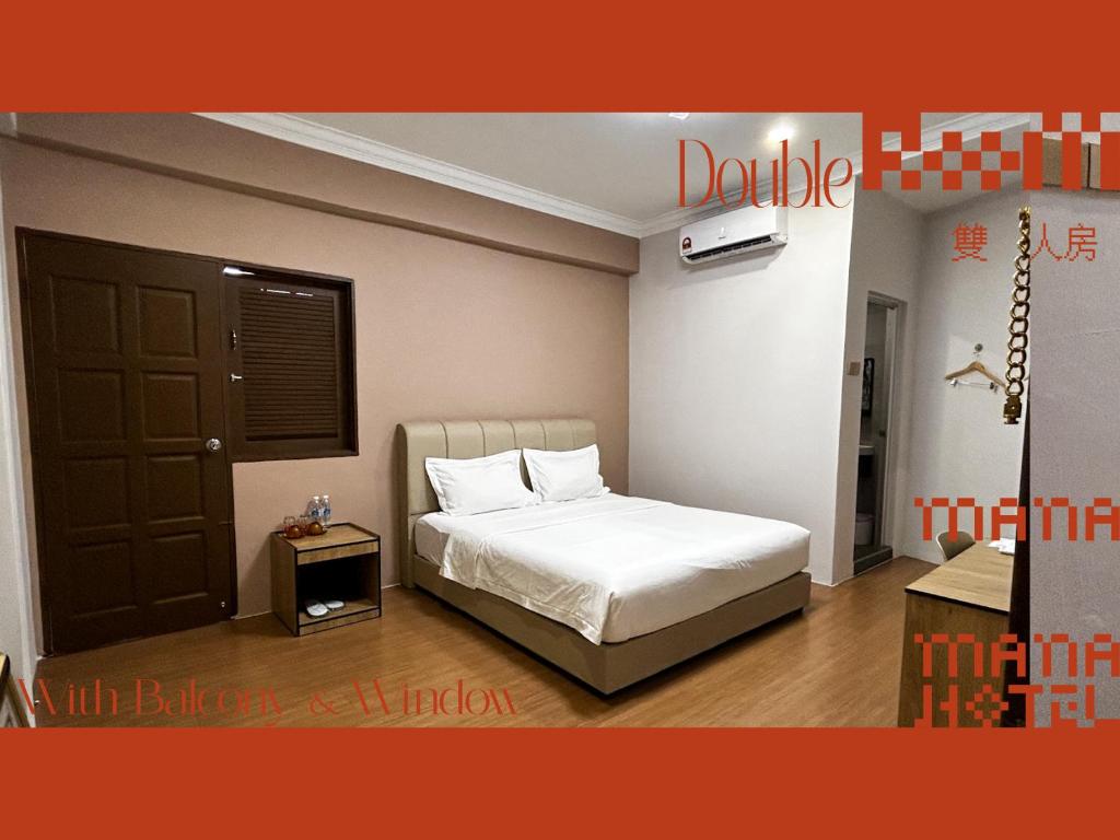 Postel nebo postele na pokoji v ubytování Mana Mana Hotel • Melaka •