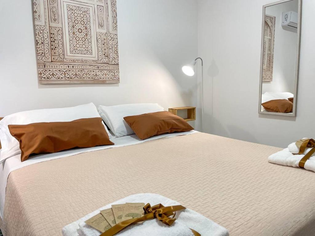 Postel nebo postele na pokoji v ubytování Big Fish Alghero Guesthouse