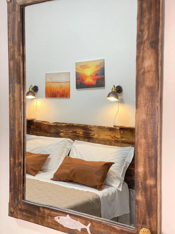 Postel nebo postele na pokoji v ubytování Big Fish Alghero Guesthouse