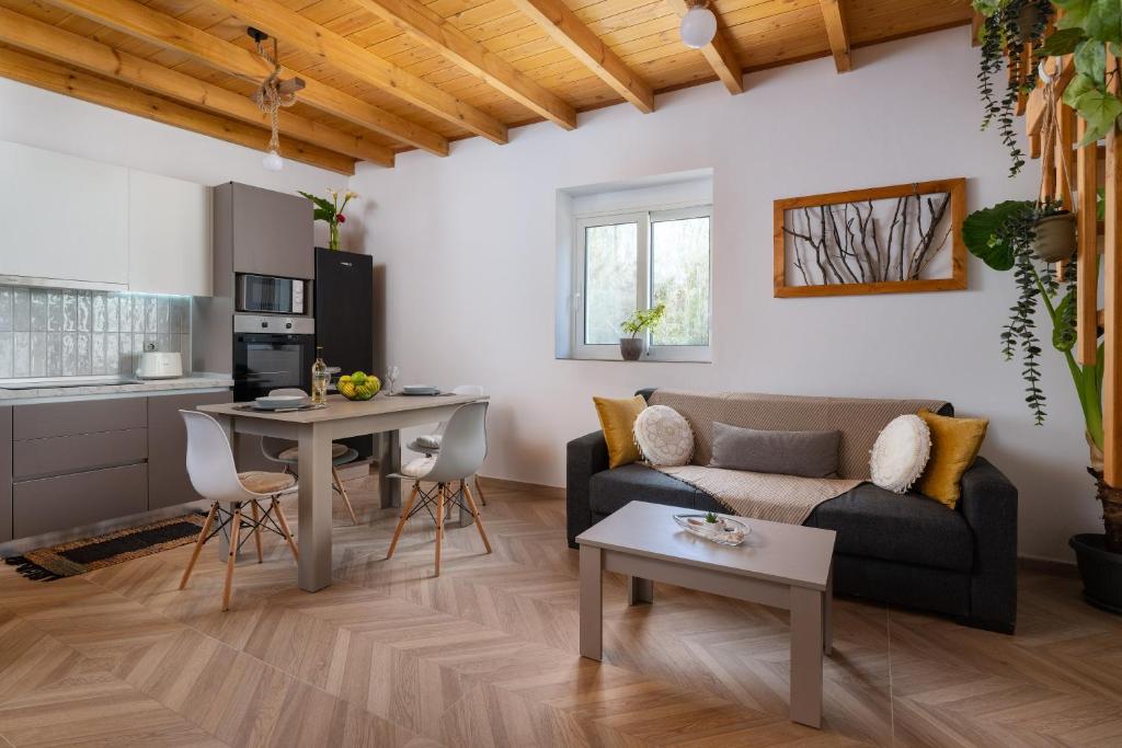 a living room with a couch and a table at Kostas Nest in Ialysos