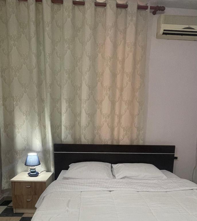 Postel nebo postele na pokoji v ubytování Bajovah Apartments & Restaurant