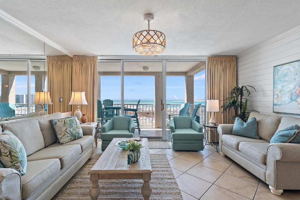 a living room with a couch and chairs and a table at Magnolia House 504 At Destin Pointe Resort in Destin