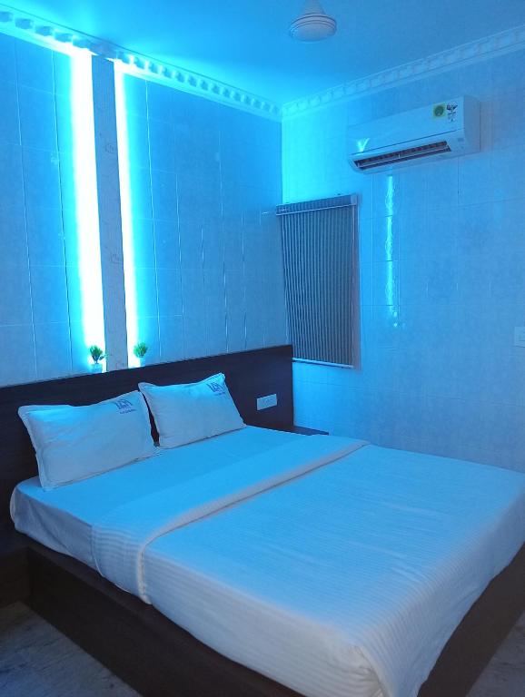 Postel nebo postele na pokoji v ubytování Ilah residency