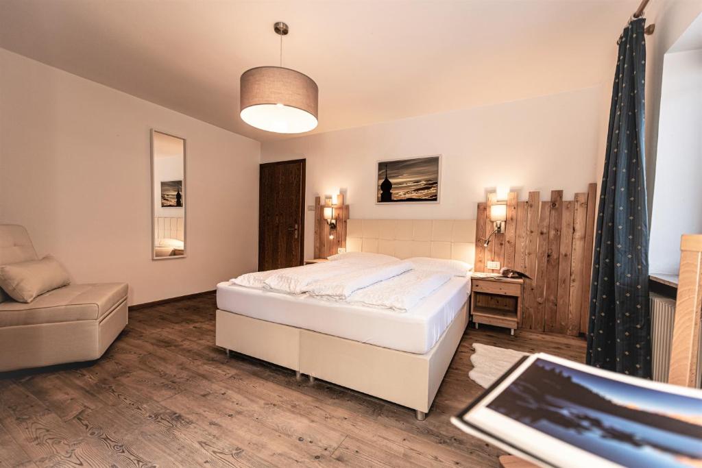 Postel nebo postele na pokoji v ubytování Hotel Profanter