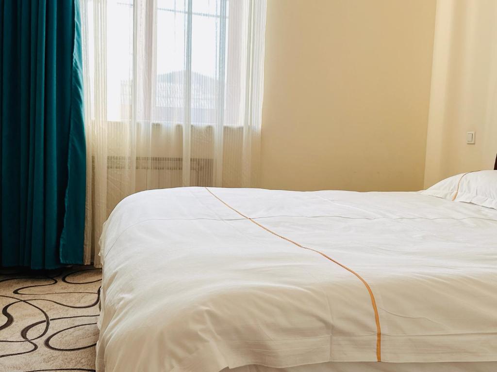 Postel nebo postele na pokoji v ubytování SD Hotel