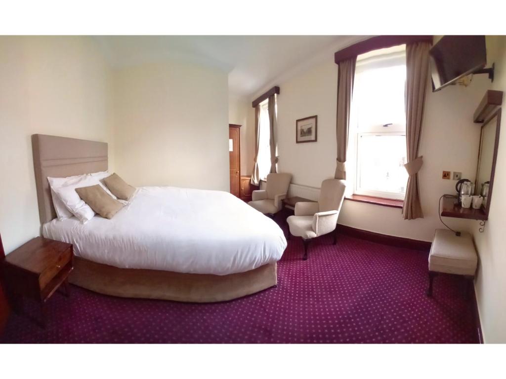 Cama ou camas em um quarto em O'Donoghue's