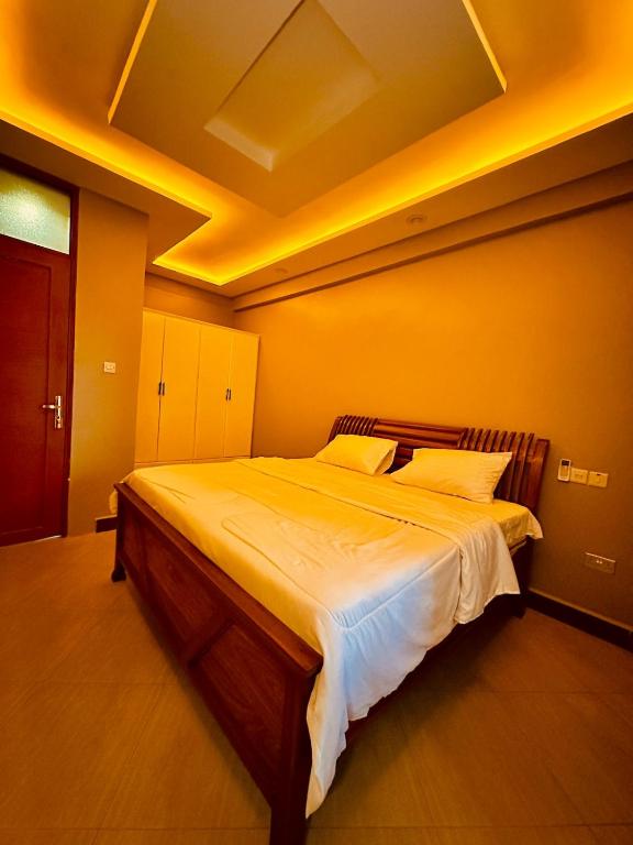 Postel nebo postele na pokoji v ubytování Nyumbani Deluxe in Kijitonyama