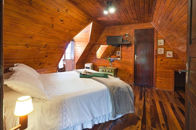 Postel nebo postele na pokoji v ubytování Casa da Colina Chalés