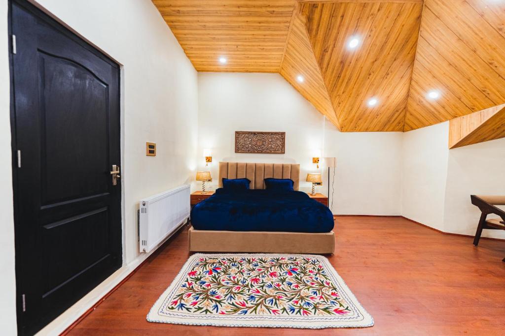 Postel nebo postele na pokoji v ubytování Chinar Wood Cottage