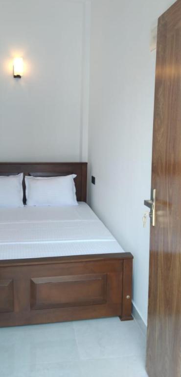 Postel nebo postele na pokoji v ubytování Mirissa Cocoon