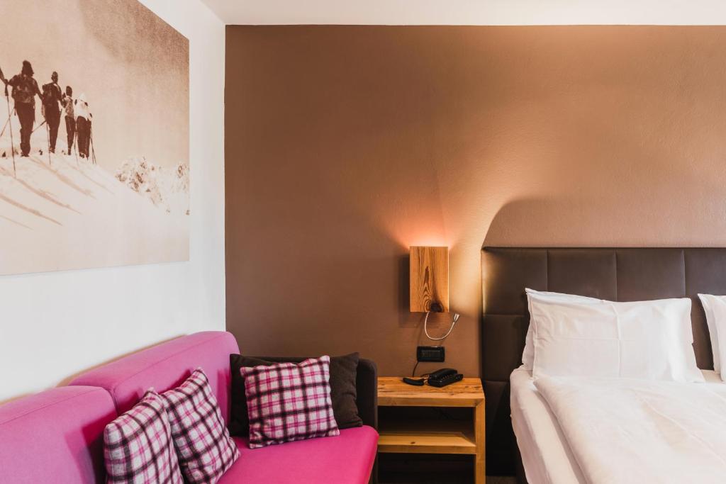 Postel nebo postele na pokoji v ubytování Hotel Arnika
