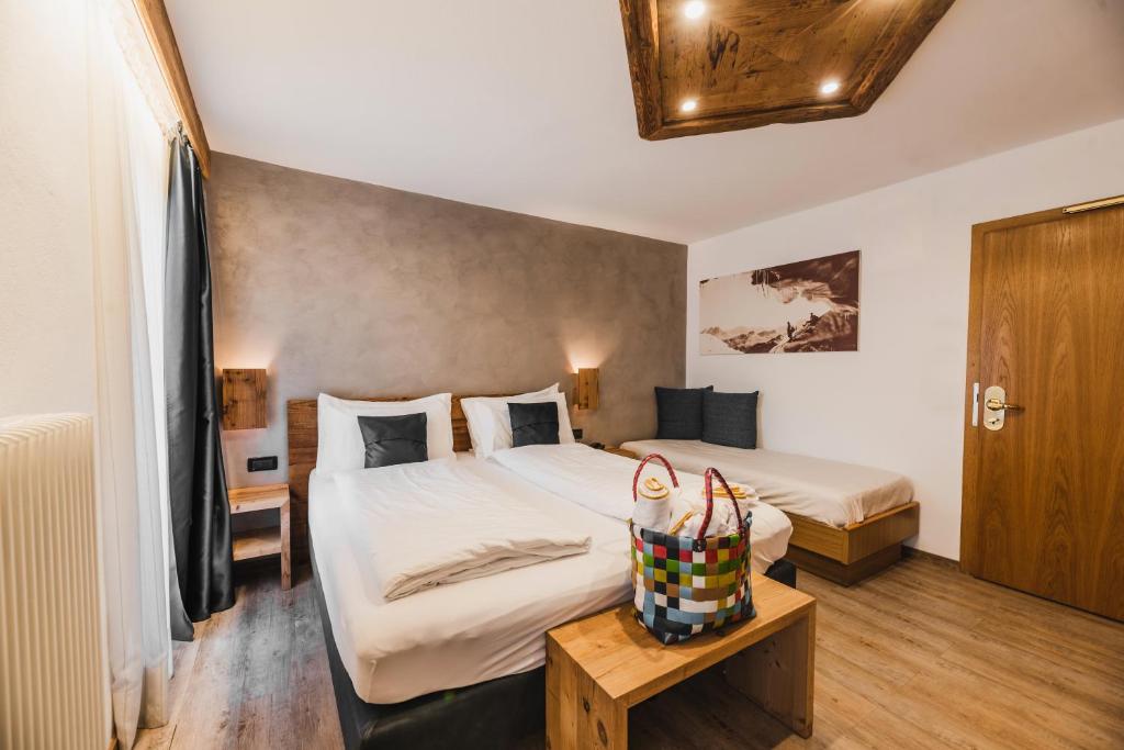 Postel nebo postele na pokoji v ubytování Hotel Arnika