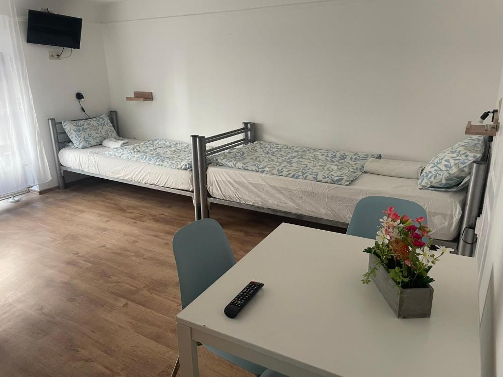 A bed or beds in a room at Center Hostel and Guest House