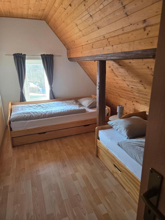 Postel nebo postele na pokoji v ubytování Apartmány Hertvinka