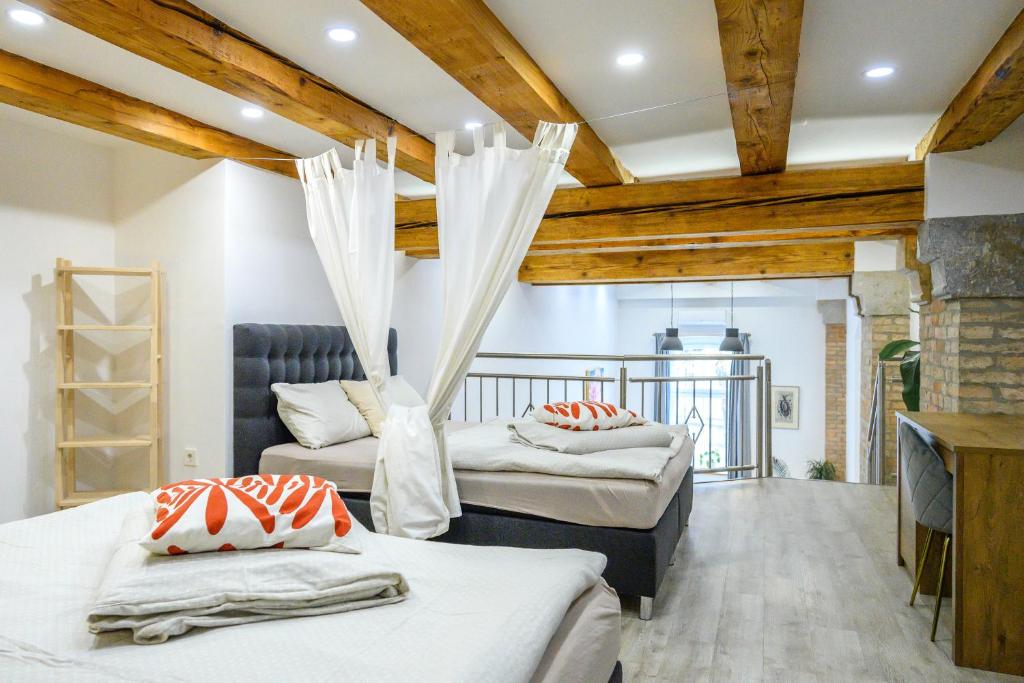 Ένα ή περισσότερα κρεβάτια σε δωμάτιο στο The Superior Loft