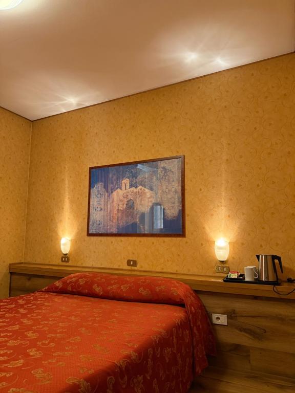 Postel nebo postele na pokoji v ubytování Hotel Al Sole