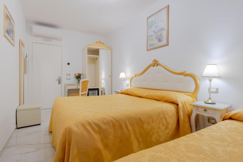 Posteľ alebo postele v izbe v ubytovaní Hotel Marte