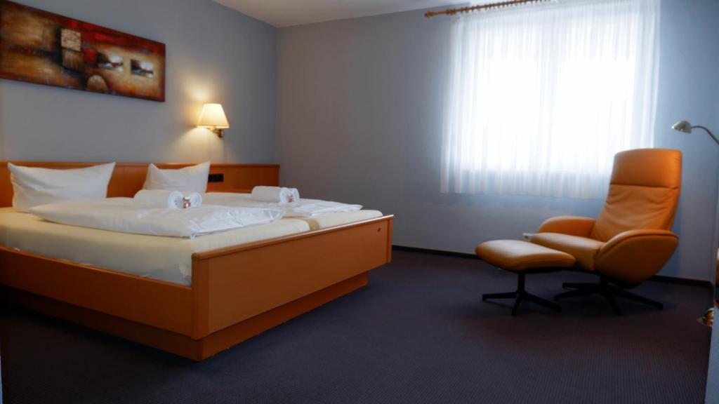 Postel nebo postele na pokoji v ubytování Hotel Walzwerk