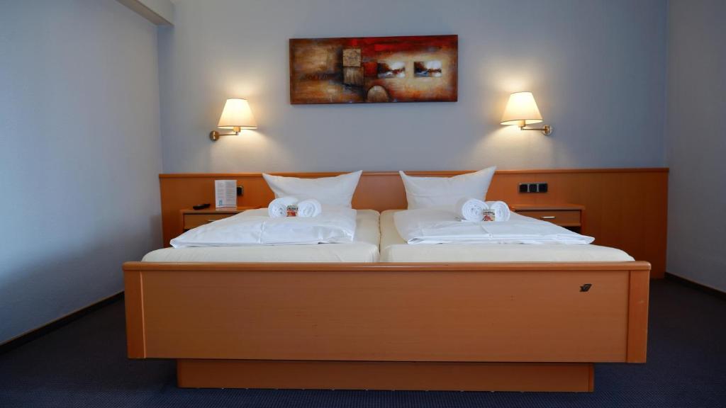 Postel nebo postele na pokoji v ubytování Hotel Walzwerk