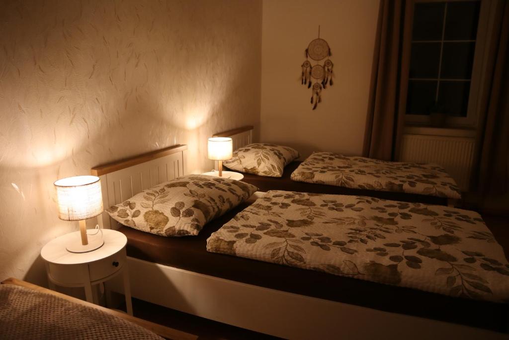 Postel nebo postele na pokoji v ubytování Olsinky