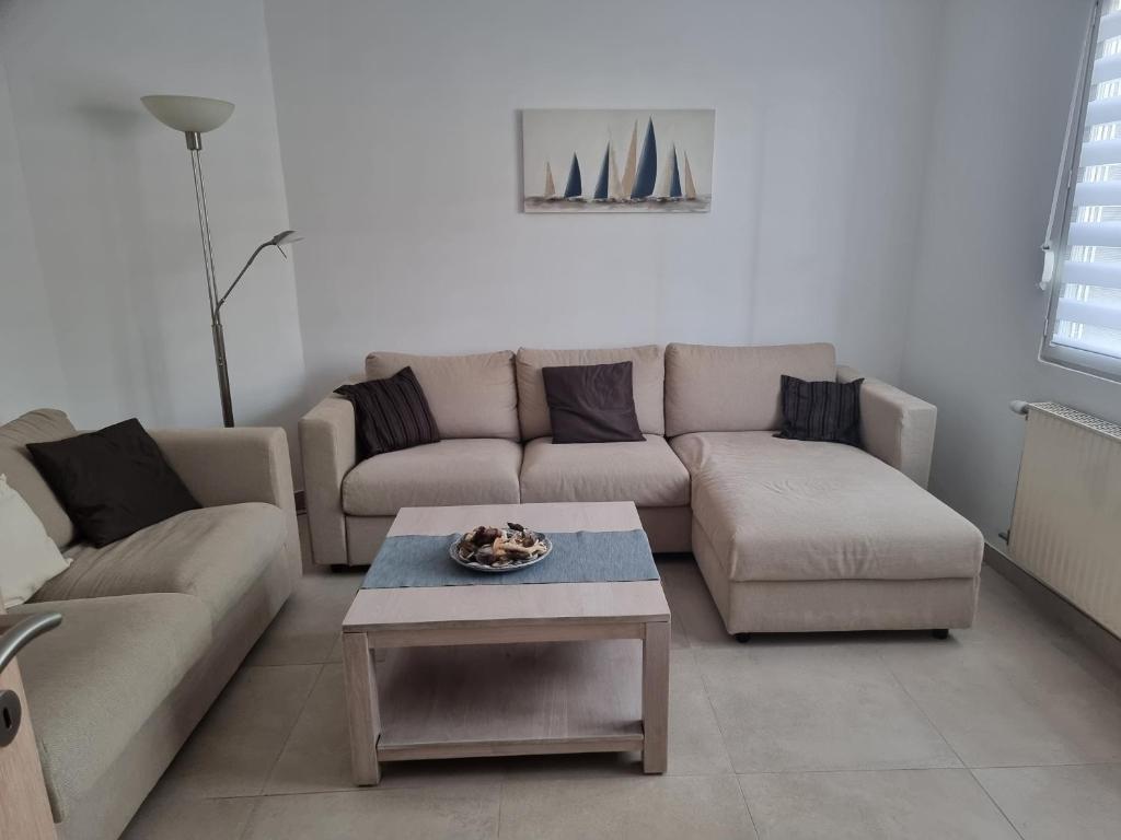 Ruang duduk di Maison 3 chambres avec jardin à Equihen-Plage