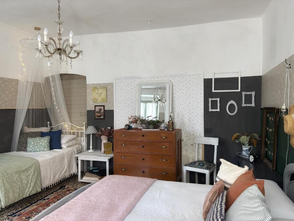 Łóżko lub łóżka w pokoju w obiekcie La casa dei nonni