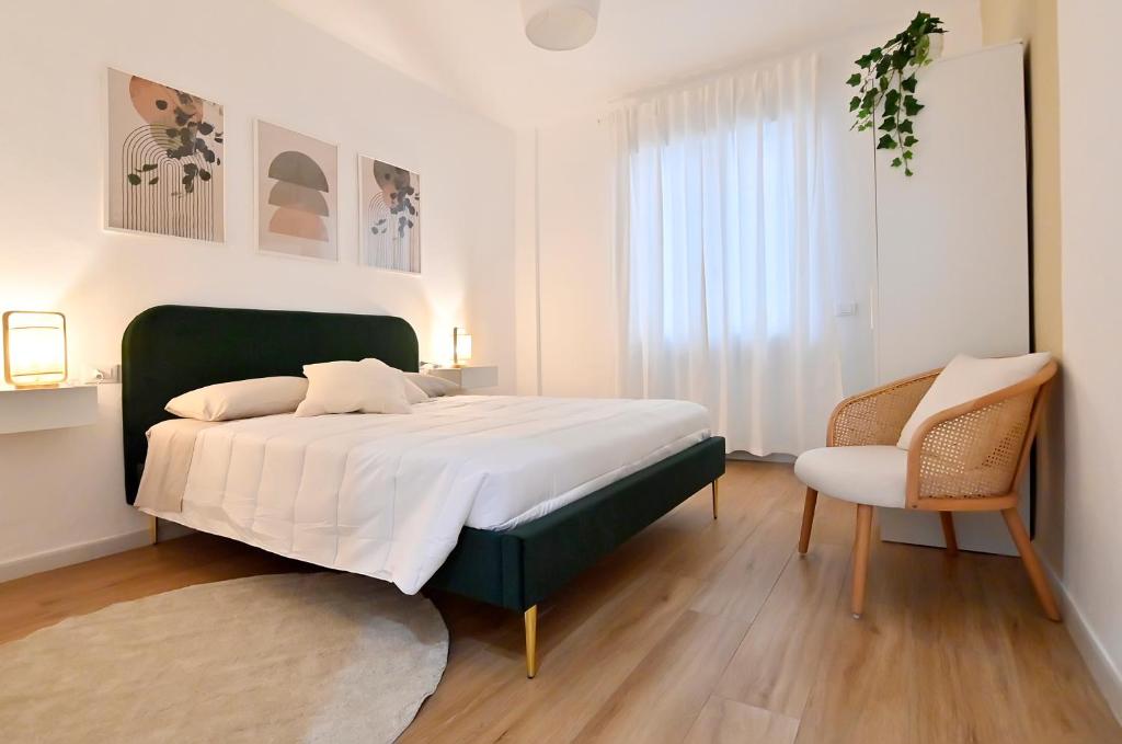 Ένα ή περισσότερα κρεβάτια σε δωμάτιο στο Centro Città la Casa di Gina