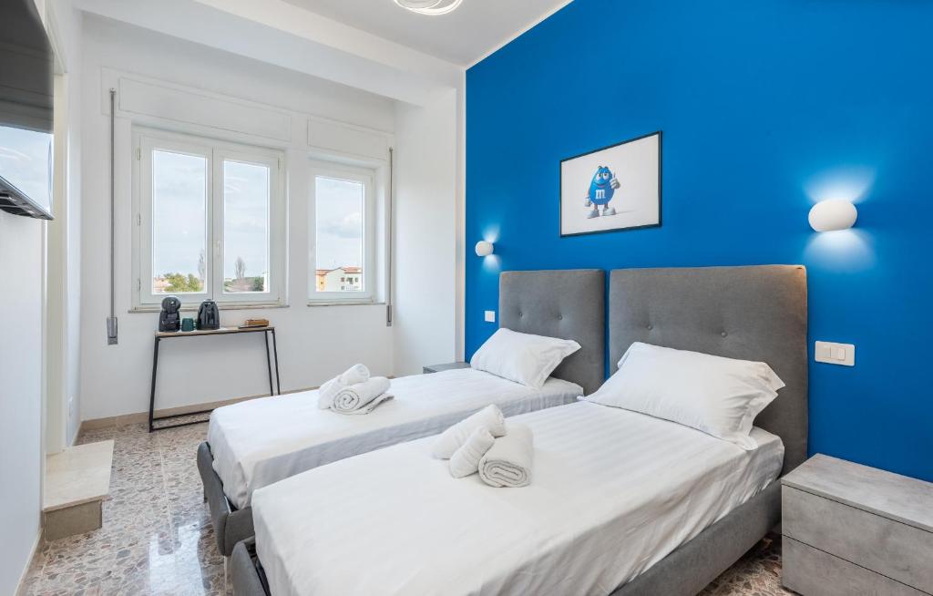 Postel nebo postele na pokoji v ubytování MM Ciampino Rooms