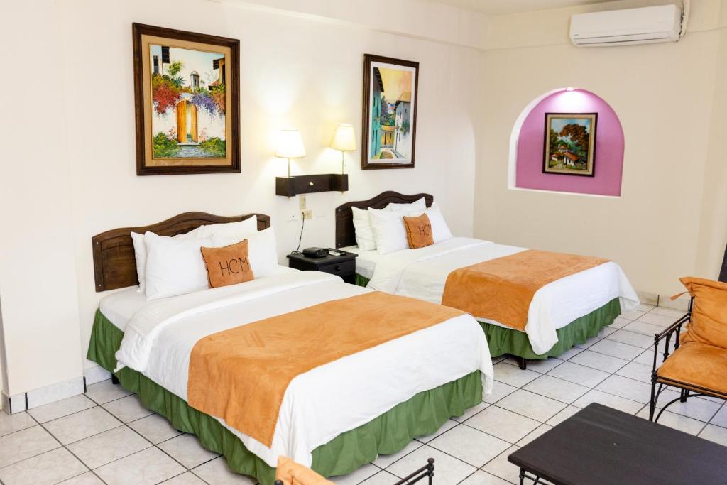 Postel nebo postele na pokoji v ubytování Hotel Camino Maya