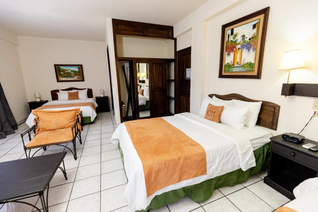 Postel nebo postele na pokoji v ubytování Hotel Camino Maya